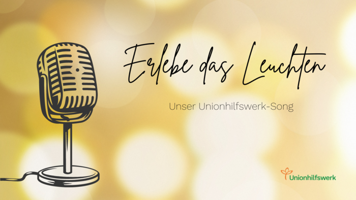 Mikrofon und der Titel des Unionhilfswerk-Songs Erlebe das Leuchten